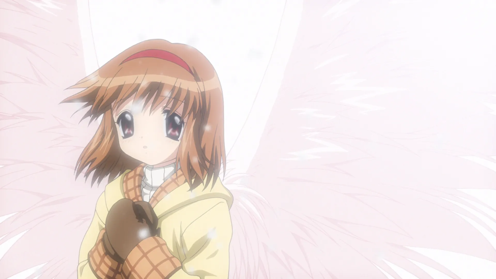 A still frame from the opening sequence of Kanon, showing one of the heroines, Tsukimiya Ayu, with her hands held to her chest, and angelic wings sprouting from her back.